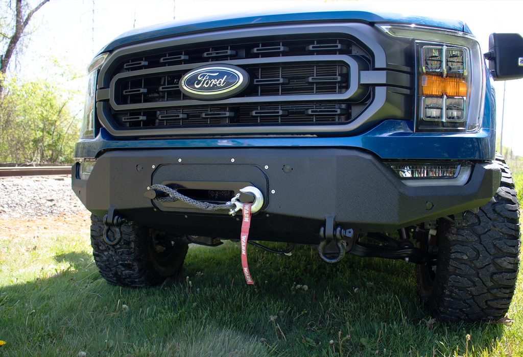 Fishbone Offroad Pelican Front Bumper Winch Plate, a testament to state-of-the-art engineering, designed for the 2021-Current Ford F-150, showcasing its robust design and perfect fit.