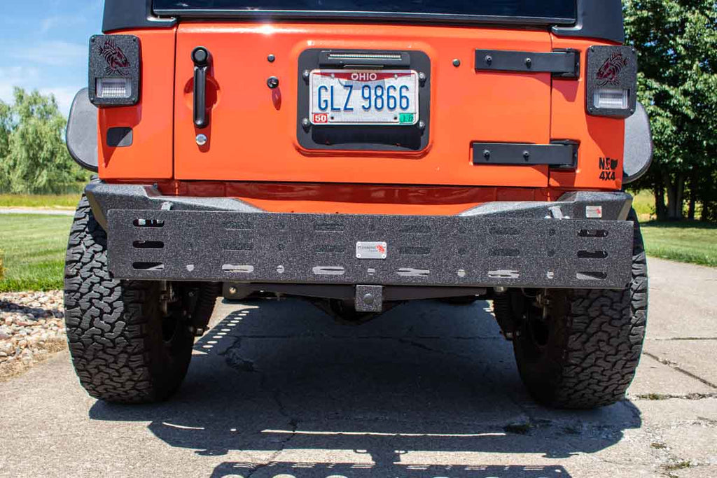 Fishbone Offroad Cargo Basket attached to a vehicle, demonstrating its sturdy construction and fit for a 2" hitch receiver.