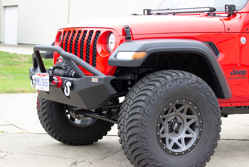 Fishbone Offroad black powder-coated fairlead license plate mount attached to a Hawse style fairlead, showcasing versatility and style.