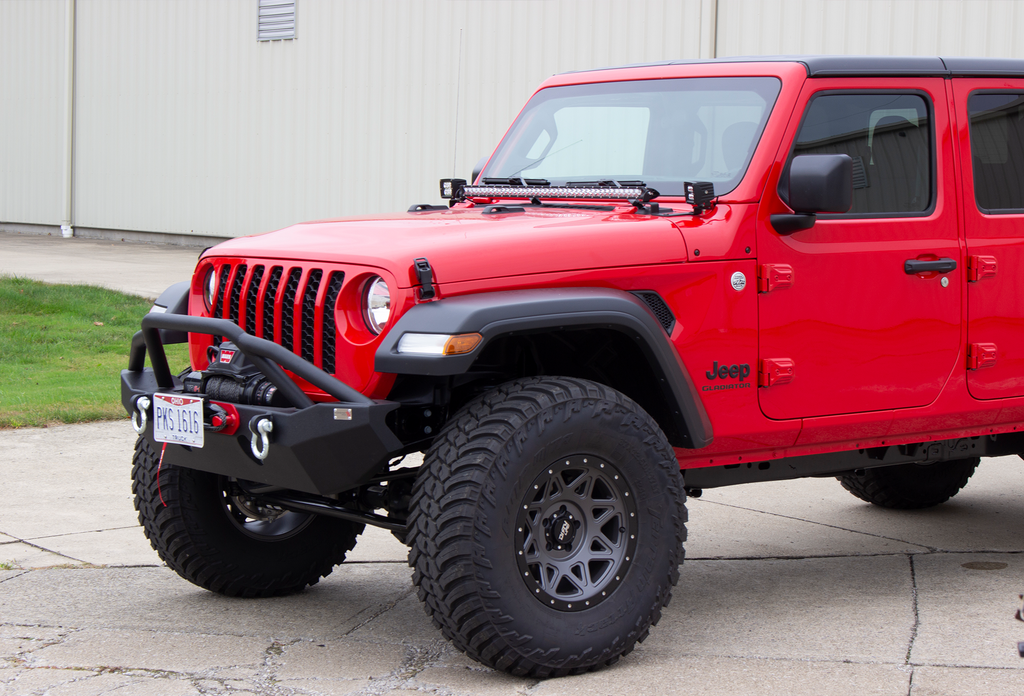 Fishbone Offroad black powder-coated fairlead license plate mount attached to a Hawse style fairlead, showcasing versatility and style.