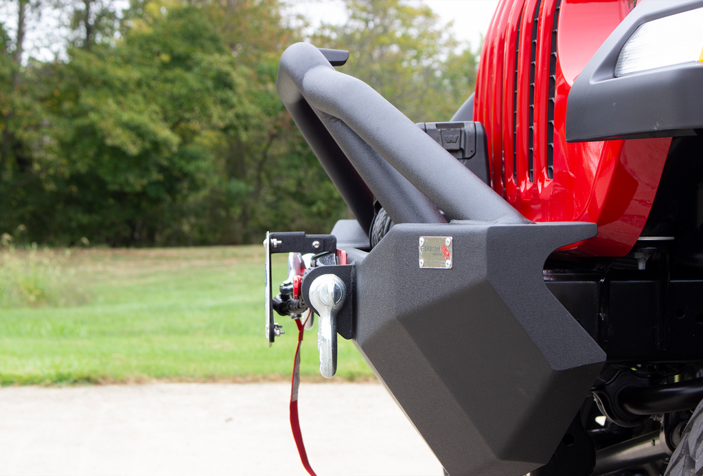 Fishbone Offroad black powder-coated fairlead license plate mount attached to a Hawse style fairlead, showcasing versatility and style.