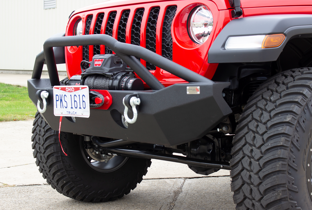 Fishbone Offroad black powder-coated fairlead license plate mount attached to a Hawse style fairlead, showcasing versatility and style.