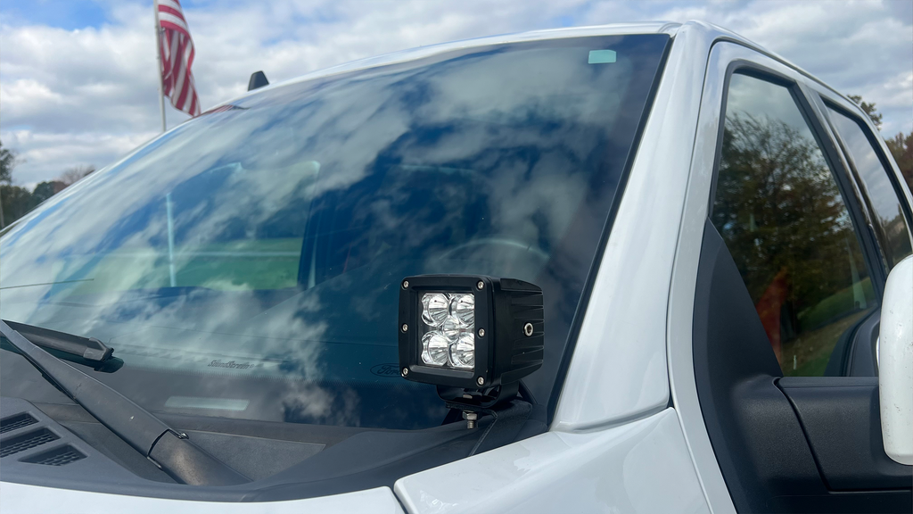 A Fishbone Offroad Pod Light Bracket designed for 2015-2023 F150 and 2017-2023 Ford Raptor trucks, suitable for all cab and bed configurations