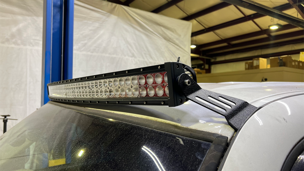 Sleek black Roof Mounted Lightbar Bracket on a Chevy Silverado