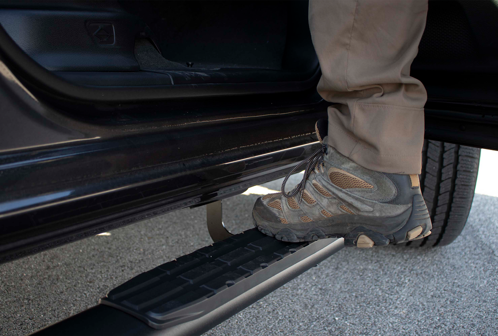 Fishbone's 5-inch oval side steps designed for Dodge Ram 1500 Crew Cab, with a distinct black textured finish and molded Fishbone grip step pad.