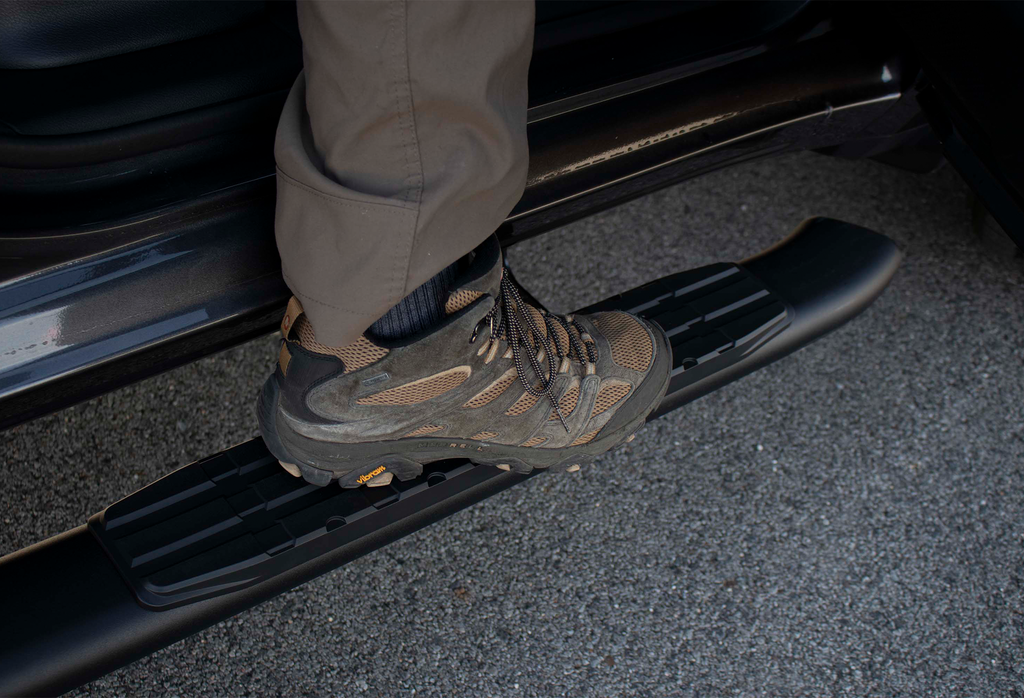 Luxurious 5-inch oval side steps in a commanding black, precision-crafted for Dodge Ram and Ram 1500, 2500, 3500 Crew Cab, accentuated by the iconic Fishbone grip step pad.