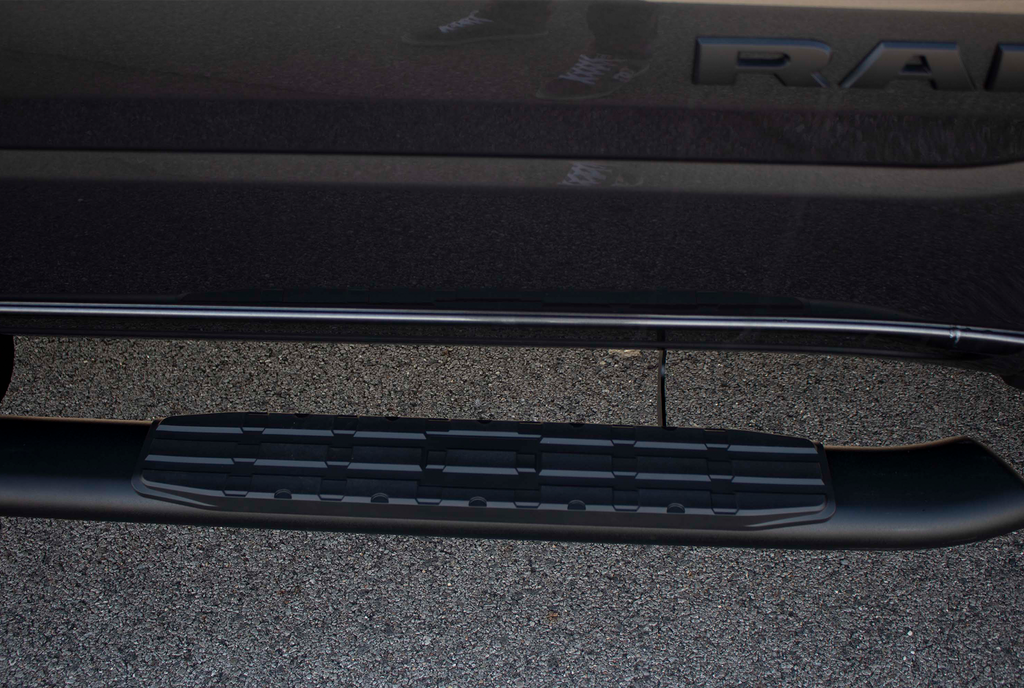 Luxurious 5-inch oval side steps in a commanding black, precision-crafted for Dodge Ram and Ram 1500, 2500, 3500 Crew Cab, accentuated by the iconic Fishbone grip step pad.
