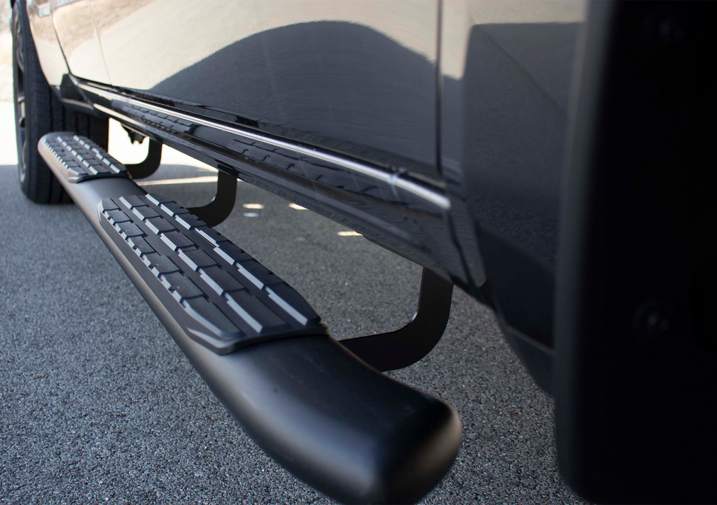 Luxurious 5-inch oval side steps in a commanding black, precision-crafted for Dodge Ram and Ram 1500, 2500, 3500 Crew Cab, accentuated by the iconic Fishbone grip step pad.