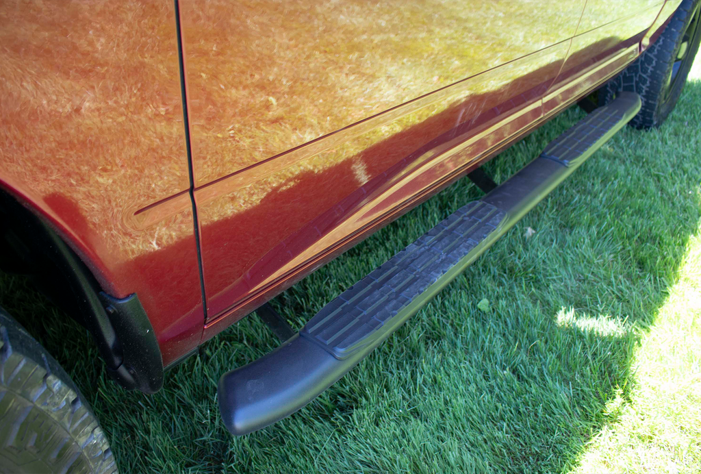 Luxurious 5-inch oval side steps in a commanding black, precision-crafted for Dodge Ram and Ram 1500, 2500, 3500 Crew Cab, accentuated by the iconic Fishbone grip step pad.