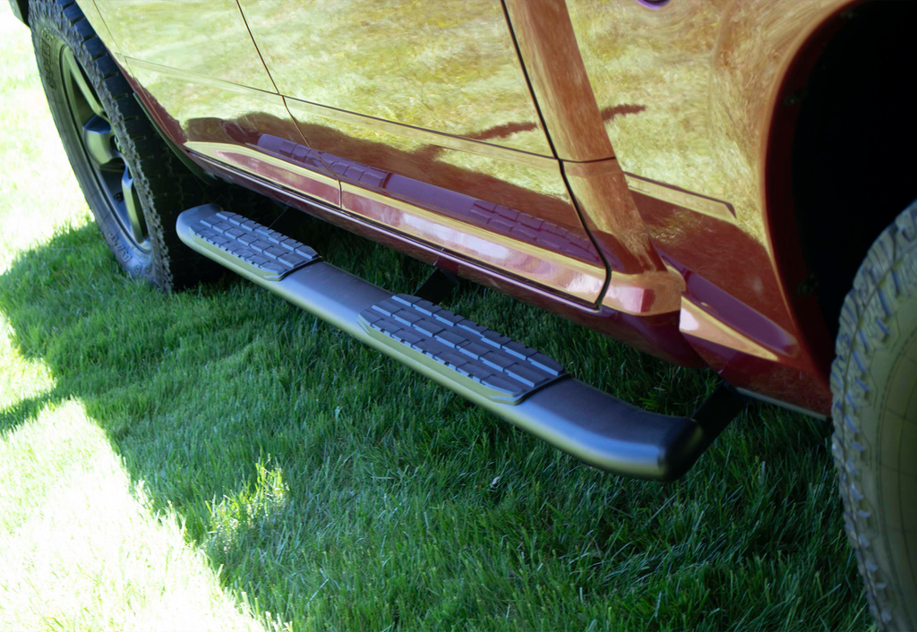 Luxurious 5-inch oval side steps in a commanding black, precision-crafted for Dodge Ram and Ram 1500, 2500, 3500 Crew Cab, accentuated by the iconic Fishbone grip step pad.