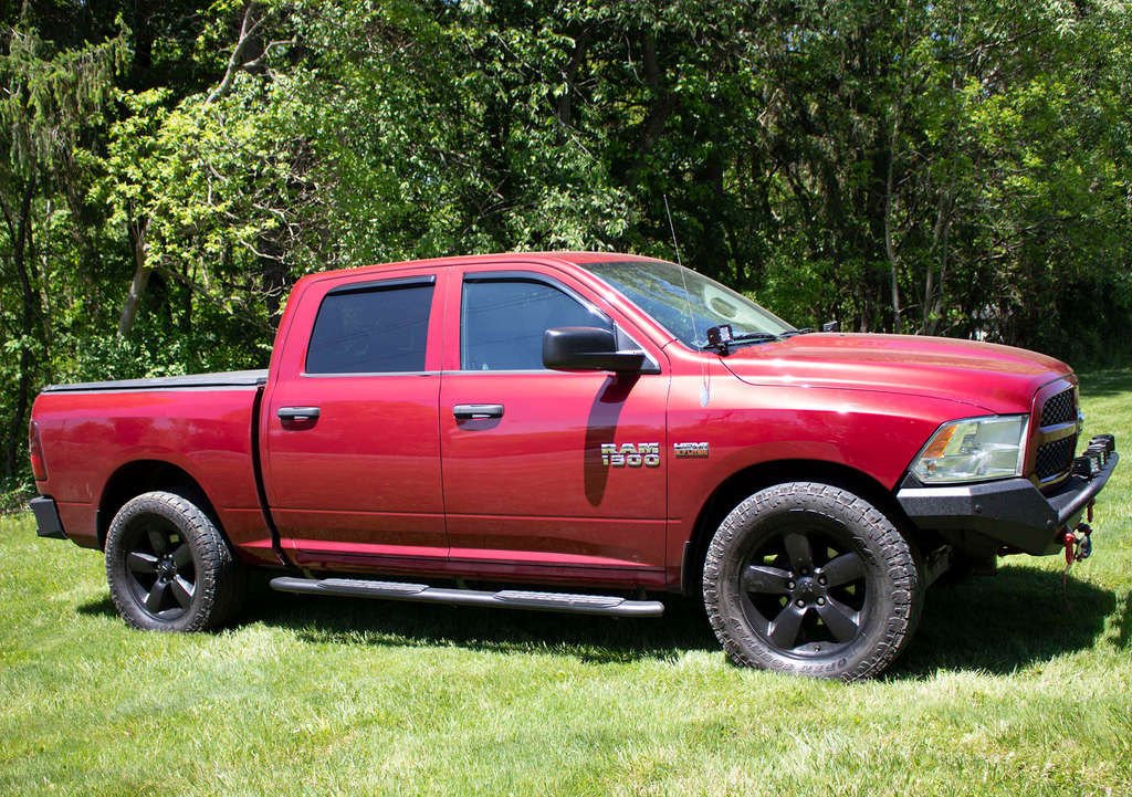 Luxurious 5-inch oval side steps in a commanding black, precision-crafted for Dodge Ram and Ram 1500, 2500, 3500 Crew Cab, accentuated by the iconic Fishbone grip step pad.
