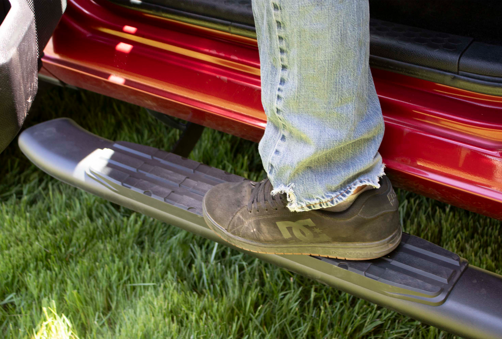 Luxurious 5-inch oval side steps in a commanding black, precision-crafted for Dodge Ram and Ram 1500, 2500, 3500 Crew Cab, accentuated by the iconic Fishbone grip step pad.