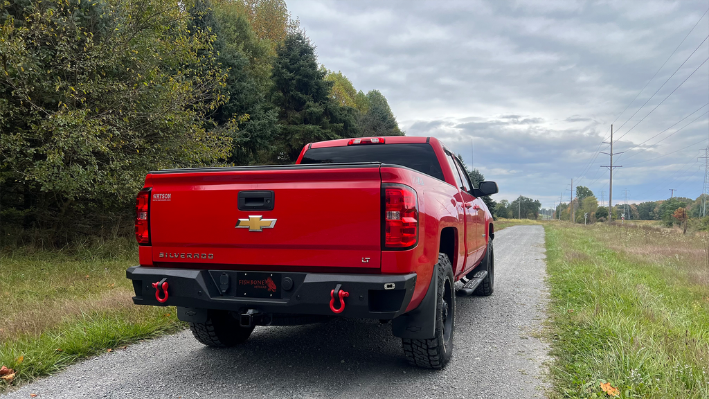 Robust 5-inch oval side steps with a distinct black textured finish, tailored for Chevrolet & GMC Double cab pickups, featuring a molded Fishbone grip step pad.