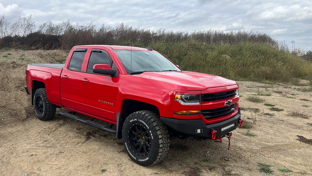 Robust 5-inch oval side steps with a distinct black textured finish, tailored for Chevrolet & GMC Double cab pickups, featuring a molded Fishbone grip step pad.