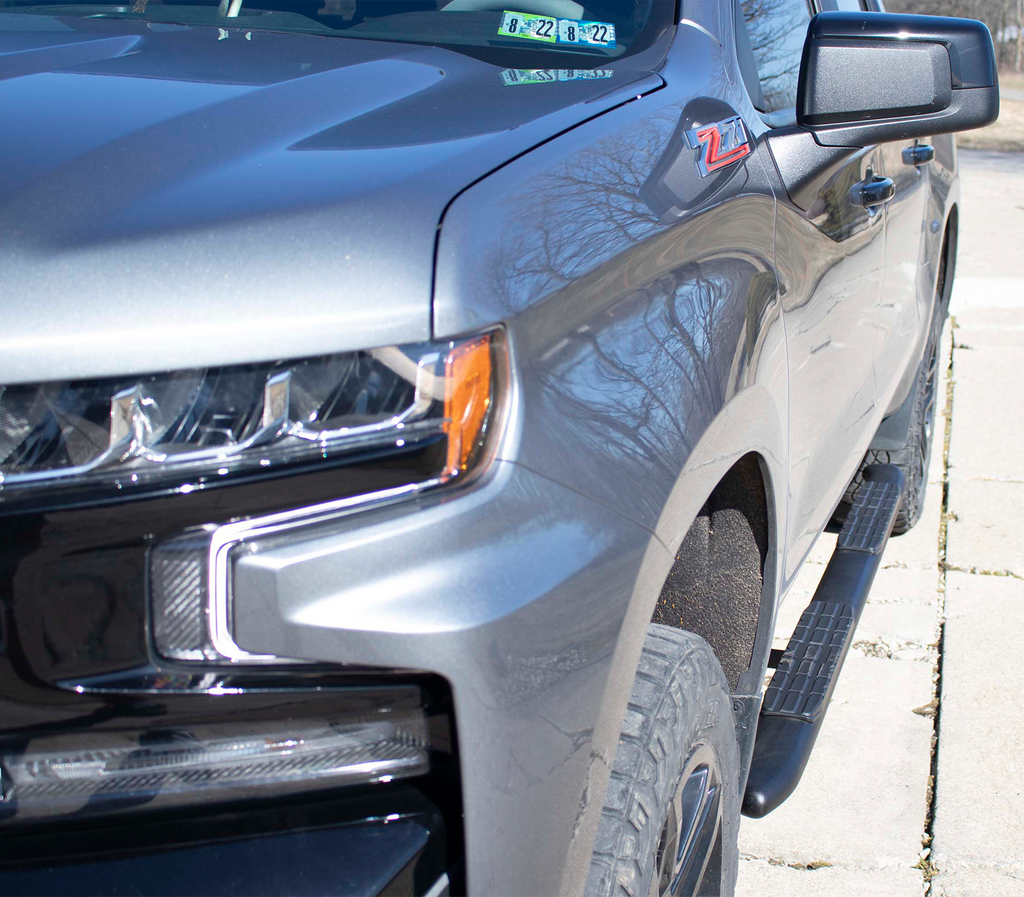 Sleek and stylish 5-inch oval side steps with a robust black finish, tailored for Chevrolet Silverado and GMC Sierra Crew Cab models, highlighted by Fishbone’s signature grip step pad.