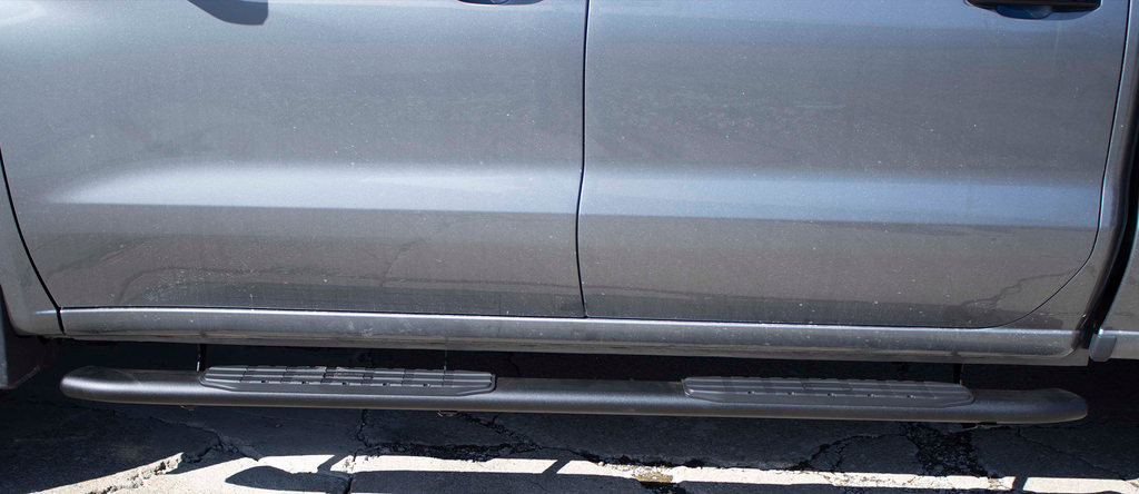 Sleek and stylish 5-inch oval side steps with a robust black finish, tailored for Chevrolet Silverado and GMC Sierra Crew Cab models, highlighted by Fishbone’s signature grip step pad.