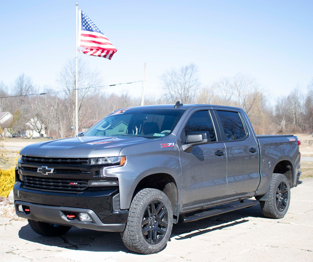 Refined 5-inch oval side steps with a robust black textured finish, precisely tailored for Chevrolet & GMC double cab pickups, complete with the signature Fishbone grip step pad.