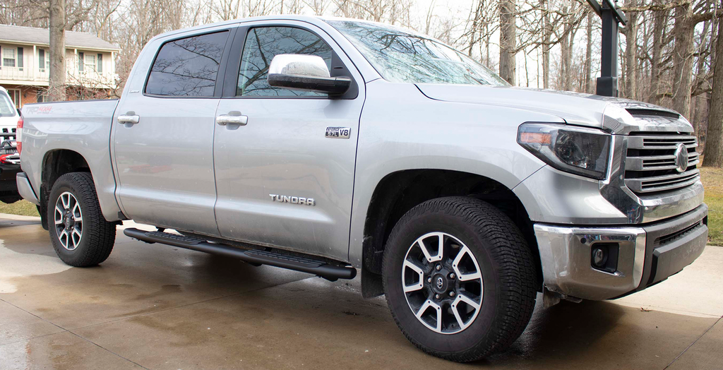 Robust 5-inch oval side steps with a sleek black textured finish, meticulously crafted for the Toyota Tundra Crew Max Cab, showcasing the unmistakable Fishbone grip step pad.