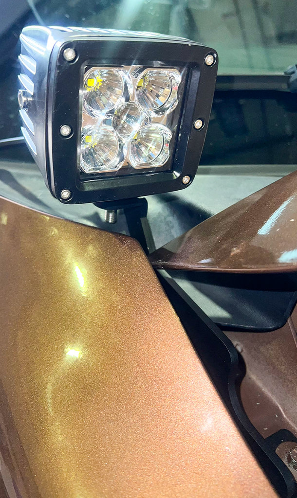 The Hood Light Pod Bracket in action, displaying enhanced light output for off-road visibility