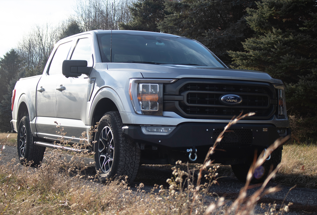 Fishbone Offroad Pelican Front Bumper with black texture powder coat and provisions for Factory OE park sensors on a 2021-Current Ford F-150.