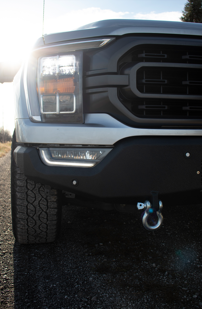 Fishbone Offroad Pelican Front Bumper with black texture powder coat and provisions for Factory OE park sensors on a 2021-Current Ford F-150.
