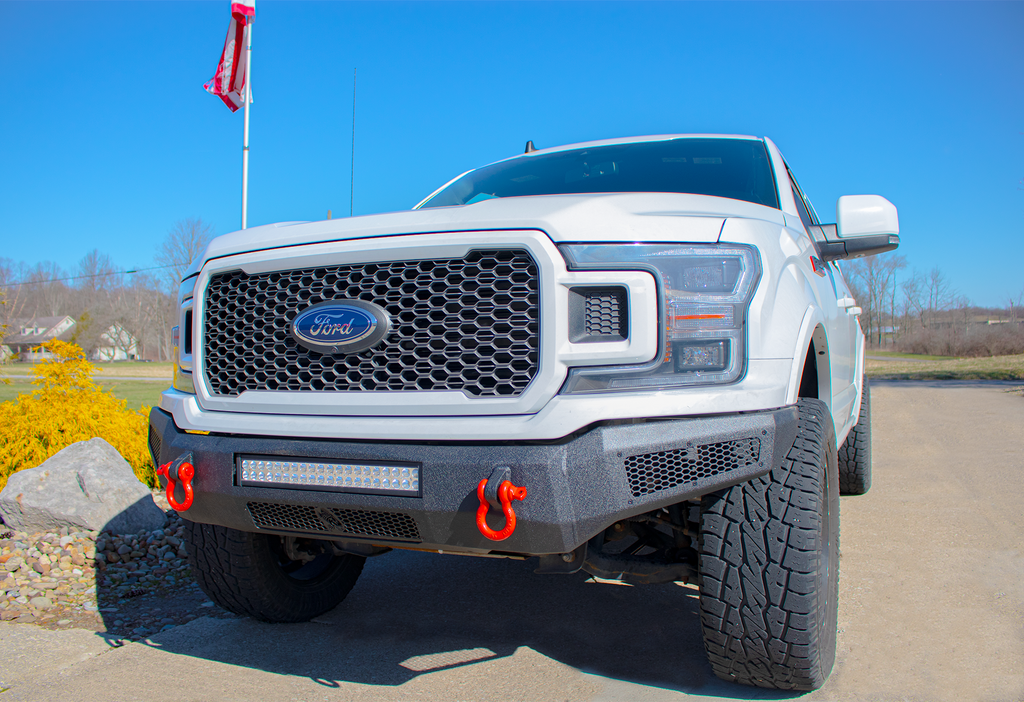 Robust black textured Fishbone Offroad Pelican Front Bumper mounted on a 2018-2020 Ford F-150, showcasing LED light mounts, front skid plate, and D-ring mounts for enhanced protection and style.