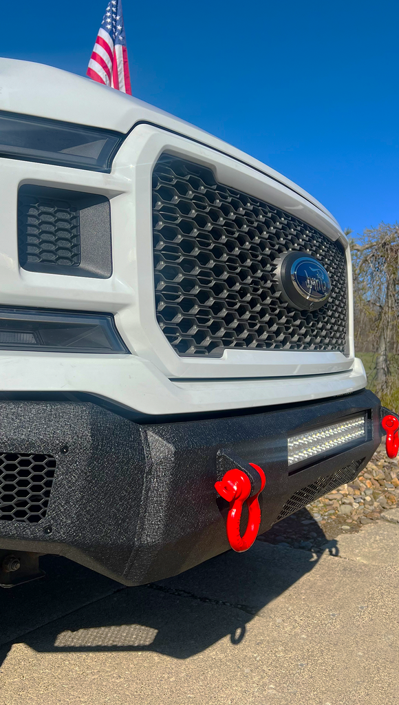 Robust black textured Fishbone Offroad Pelican Front Bumper mounted on a 2018-2020 Ford F-150, showcasing LED light mounts, front skid plate, and D-ring mounts for enhanced protection and style.