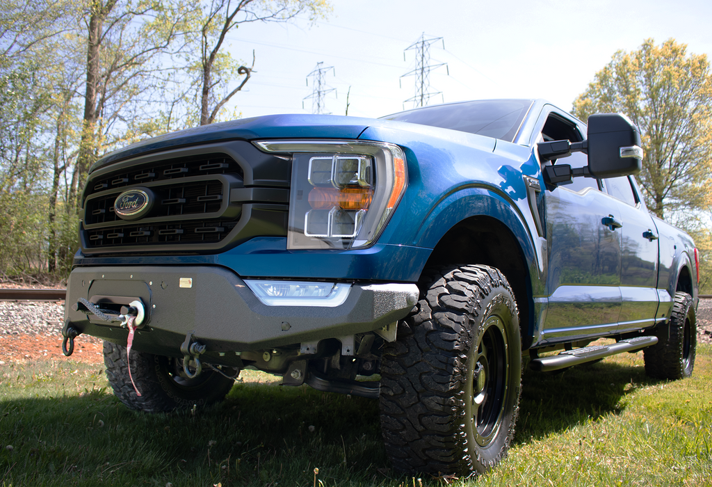 Fishbone Offroad Pelican Front Bumper Winch Plate, a testament to state-of-the-art engineering, designed for the 2021-Current Ford F-150, showcasing its robust design and perfect fit.