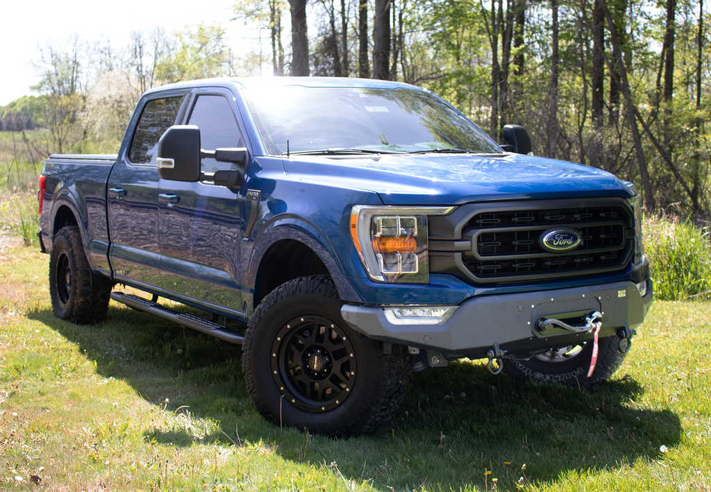 Fishbone Offroad Pelican Front Bumper Winch Plate, a testament to state-of-the-art engineering, designed for the 2021-Current Ford F-150, showcasing its robust design and perfect fit.