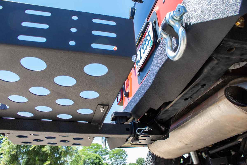 Fishbone Offroad Cargo Basket attached to a vehicle, demonstrating its sturdy construction and fit for a 2" hitch receiver.