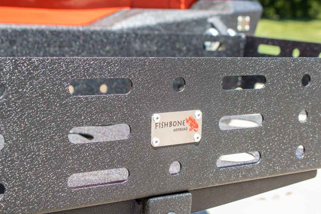 Fishbone Offroad Cargo Basket attached to a vehicle, demonstrating its sturdy construction and fit for a 2" hitch receiver.