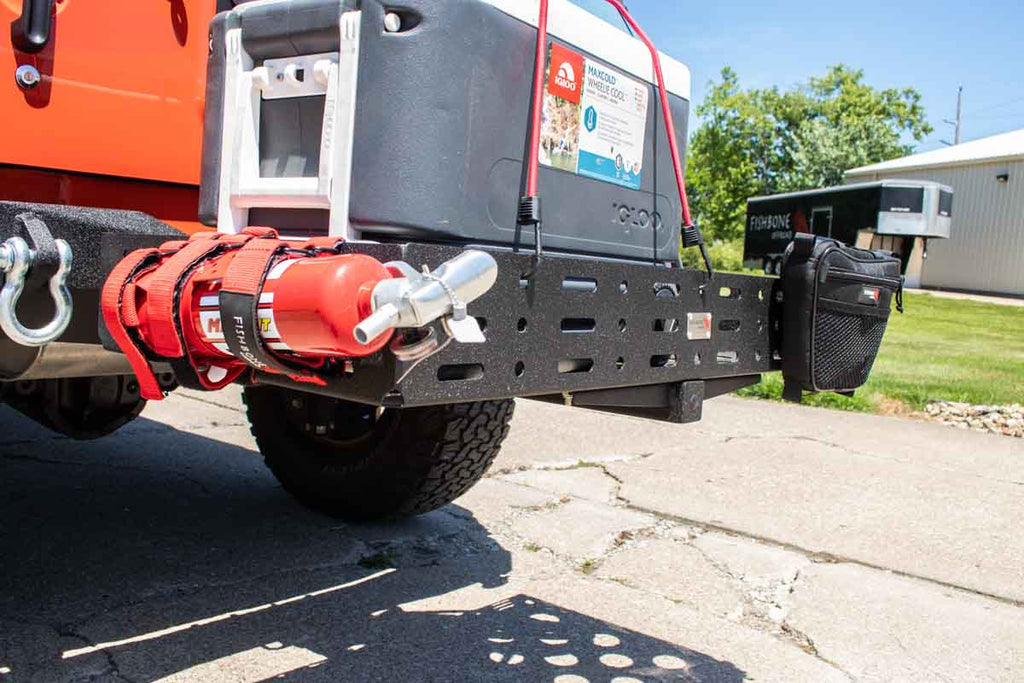 Fishbone Offroad Cargo Basket attached to a vehicle, demonstrating its sturdy construction and fit for a 2" hitch receiver.