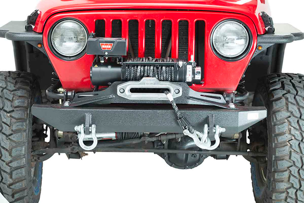 Jeep Wrangler equipped with the Fishbone Offroad Piranha Series Front Bumper and Raised Winch Plate, ready for off-roading.