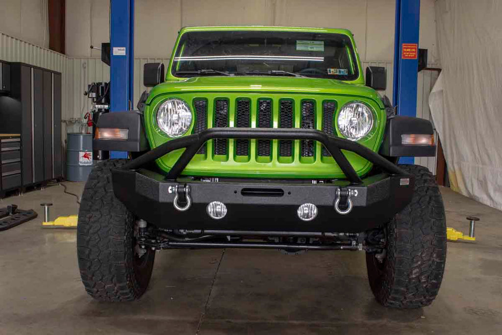 Fishbone Offroad Mid Width Front Winch Bumper, expertly designed for modern Jeep Wrangler JL and Gladiator JT models, showcasing top-tier protection and style.