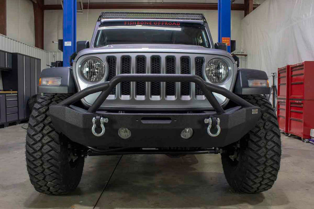 Fishbone Offroad Mid Width Front Winch Bumper, expertly designed for modern Jeep Wrangler JL and Gladiator JT models, showcasing top-tier protection and style.