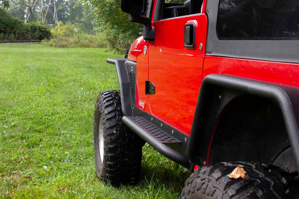 Fishbone Offroad Rock Sliders with a Tube Side Step, expertly crafted for Jeep Wrangler TJ, showcasing robust protection and elegant design.