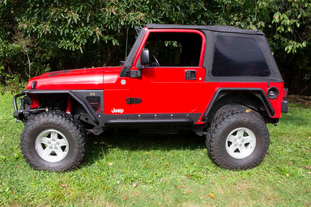 Fishbone Offroad Rock Sliders with a Tube Side Step, expertly crafted for Jeep Wrangler TJ, showcasing robust protection and elegant design.