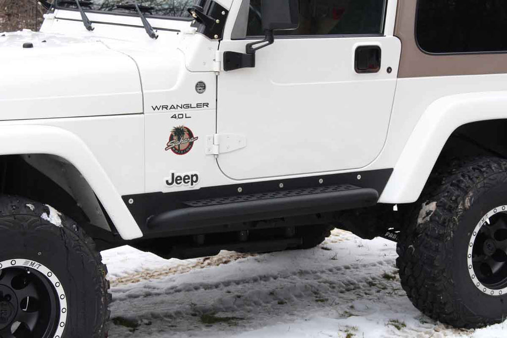 Fishbone Offroad Rock Sliders with a Tube Side Step, expertly crafted for Jeep Wrangler TJ, showcasing robust protection and elegant design.