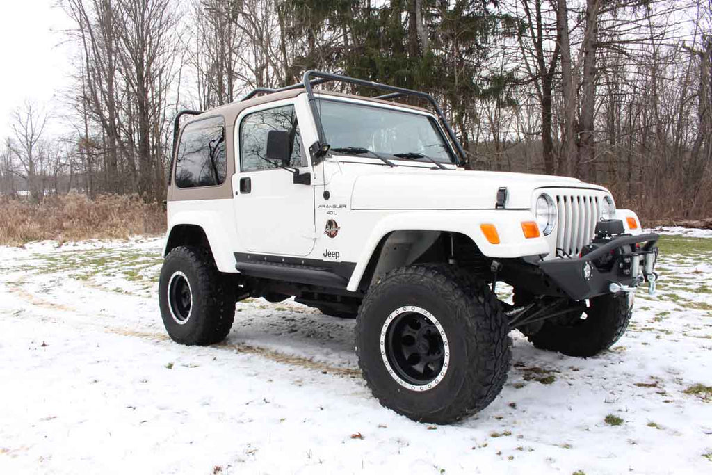 Fishbone Offroad Rock Sliders with a Tube Side Step, expertly crafted for Jeep Wrangler TJ, showcasing robust protection and elegant design.