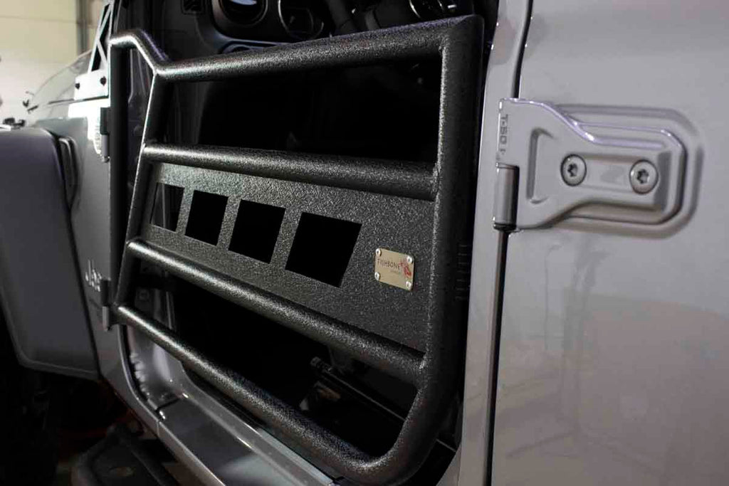Fishbone Offroad black powder-coated tube doors on a Jeep Wrangler JL.