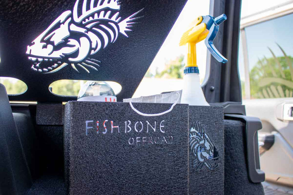 Fishbone Wheel Well Storage Bin nestled perfectly in the Jeep's wheel well.