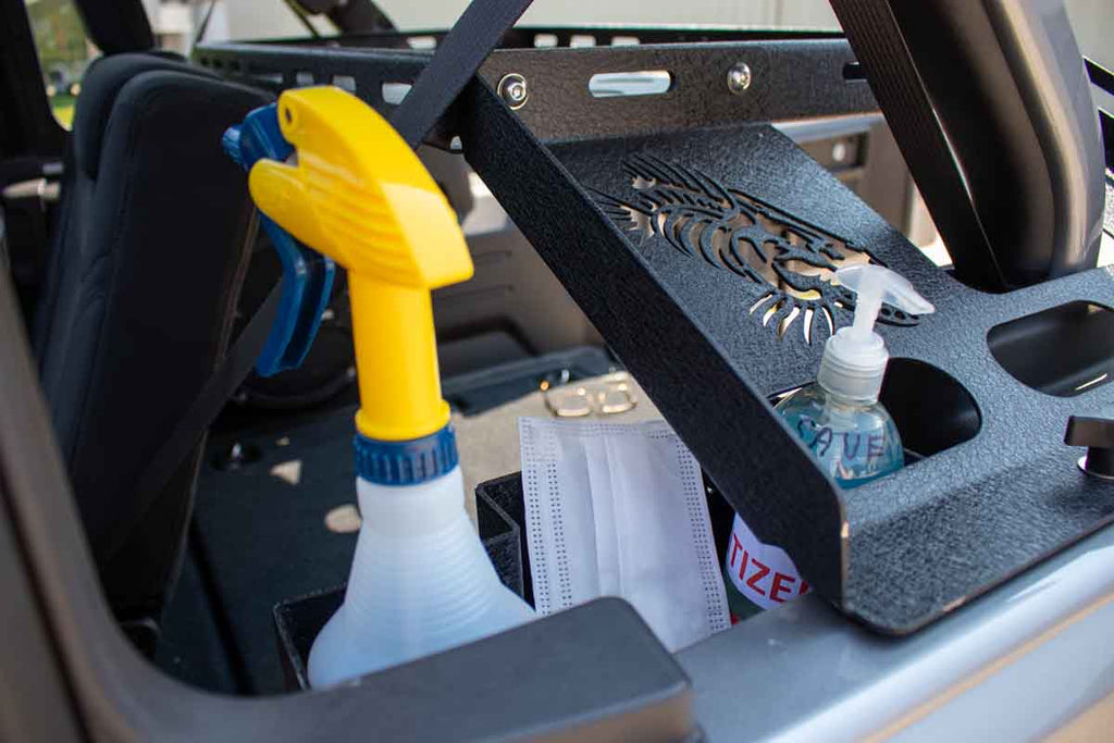 Fishbone Wheel Well Storage Bin nestled perfectly in the Jeep's wheel well.